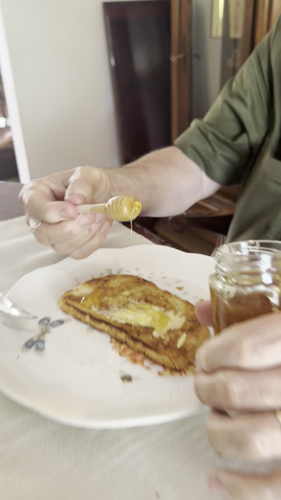 Drizzling honey on toast